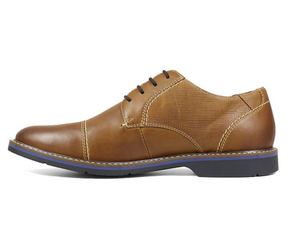 The Nunn Bush Pasadena Cap Toe Oxford features a classic cap toe with modern design details like contrast stitching, mixed textures, and a cool blue-lined midsole. To add comfort to the equation, it also has a molded Memory Foam footbed and a Casual Flex sole for unparalleled comfort.