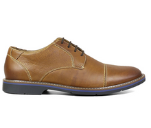 Load image into Gallery viewer, The Nunn Bush Pasadena Cap Toe Oxford features a classic cap toe with modern design details like contrast stitching, mixed textures, and a cool blue-lined midsole. To add comfort to the equation, it also has a molded Memory Foam footbed and a Casual Flex sole for unparalleled comfort.
